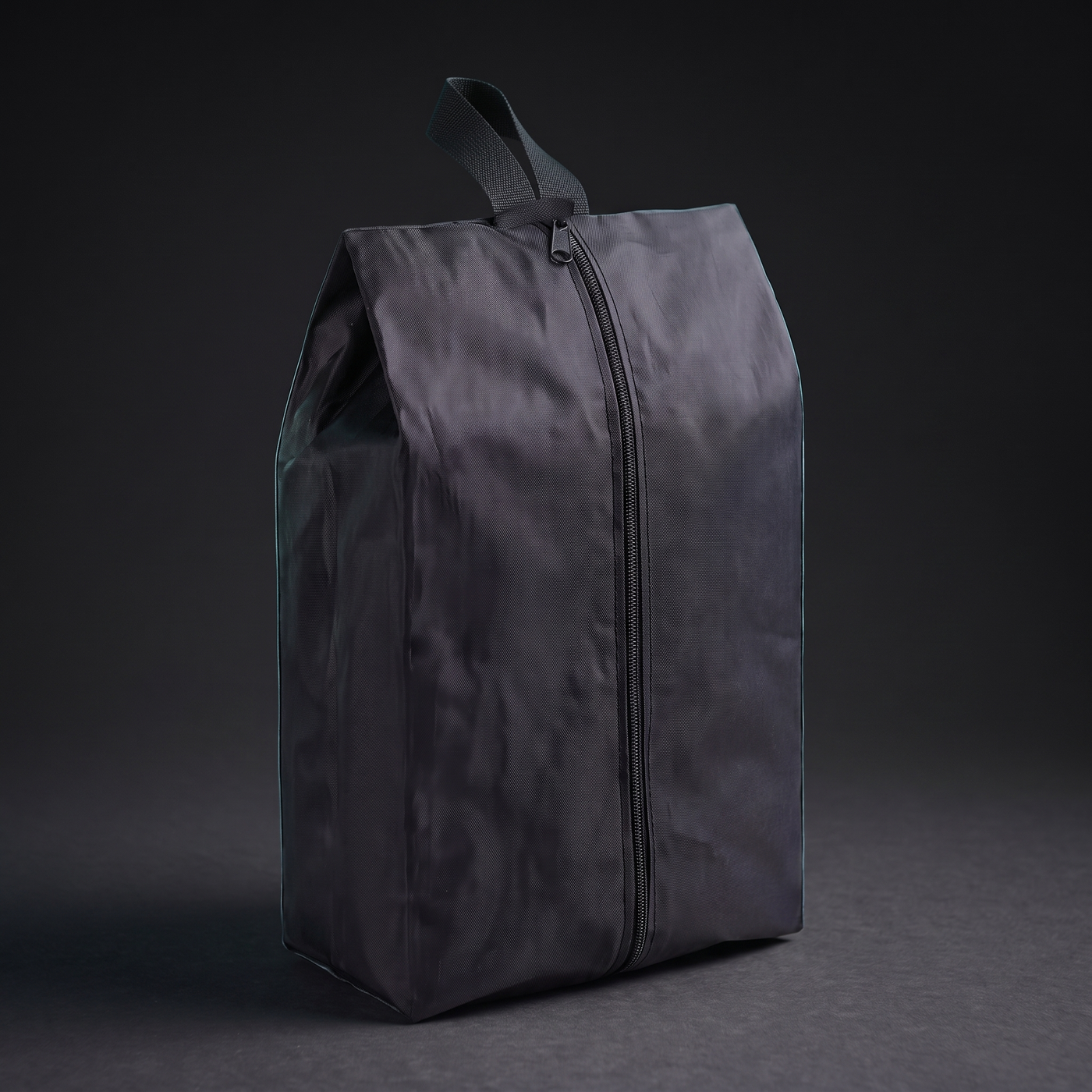 Sac à chaussures Voyra — détail zip et poignée
